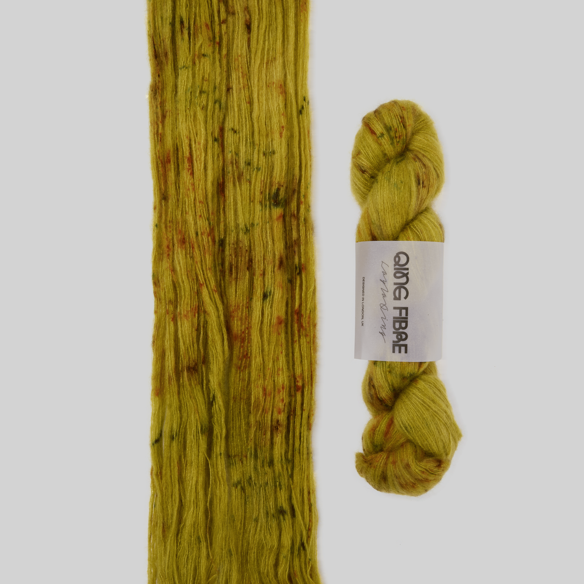 Veranita Guardian yarn, with an open skein and twisted skein on a grey background