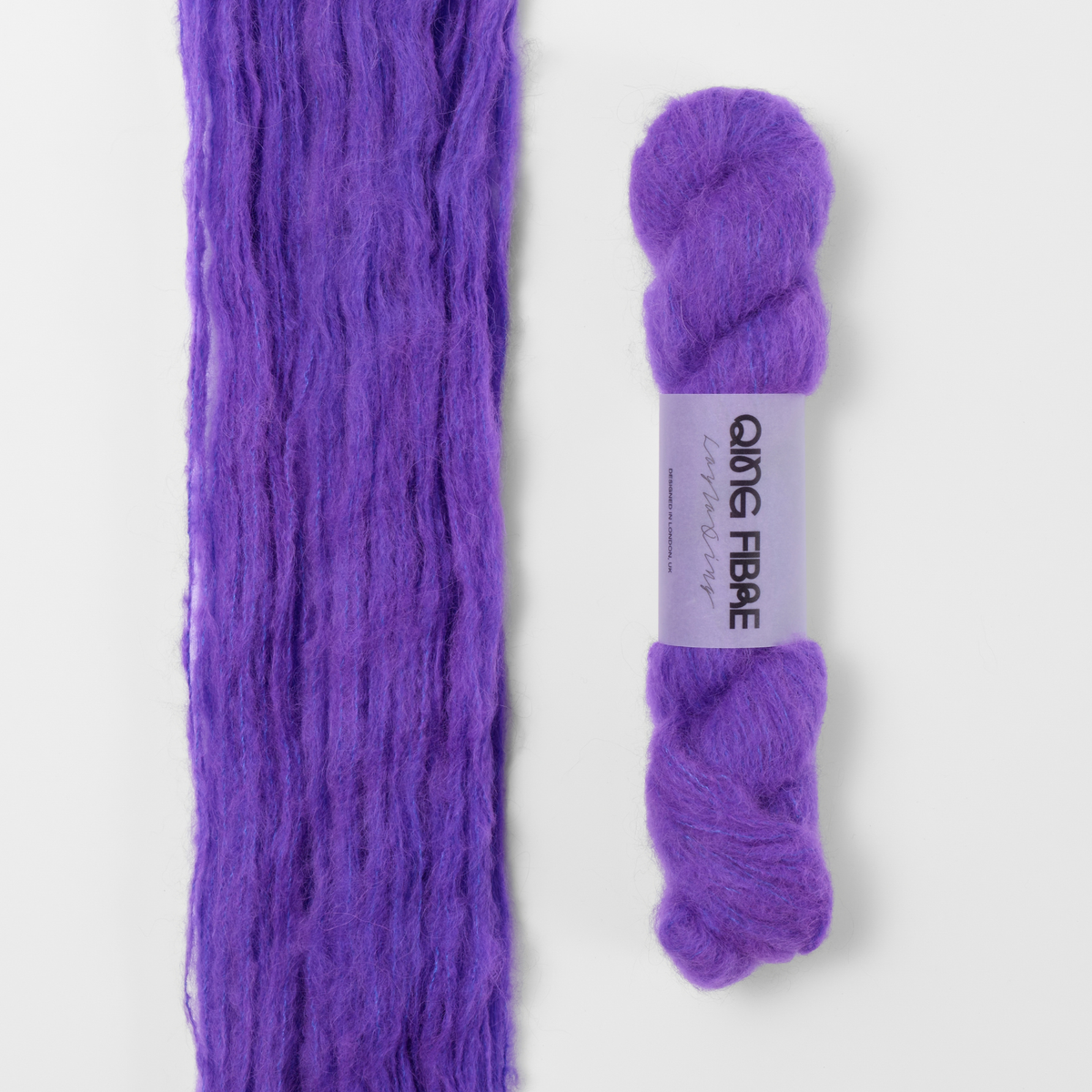Prince Melted Baby Suri 25g: violet purple yarn, shown loose beside a labelled hank.