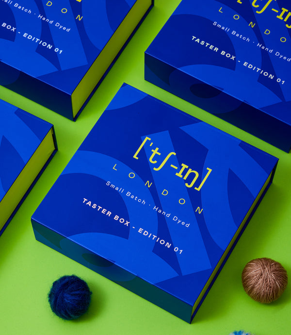 Qing Fibre Taster Box packaging — blue branded boxes with London small-batch hand-dyed yarn branding