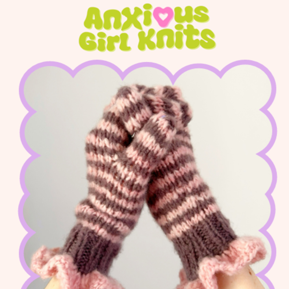 Knitted fingerless gloves with striped pattern held by a hand, branded 'Anxious Girl Knits'.