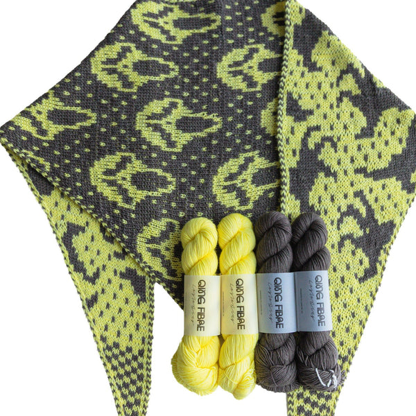 Slasher Poltergeist triangle scarf in Cocoon and Soot with four matching yarn skeins