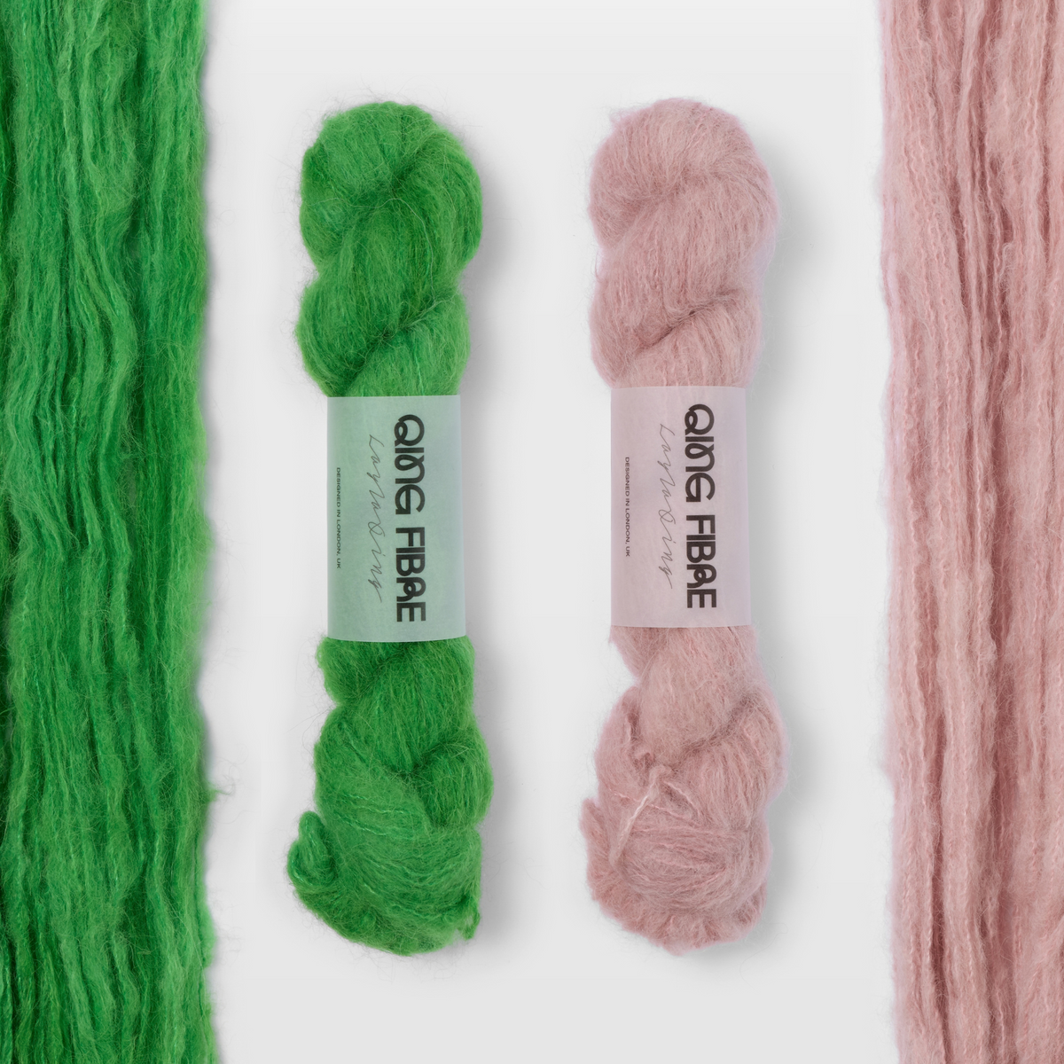 Grass and Soft Clay Melted Baby Suri 25g yarn, with two twisted skeins between the open skeins on a grey background.
