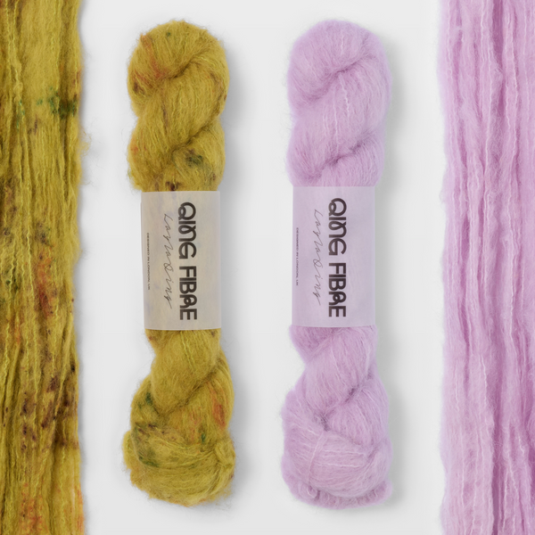Guardian and Thistle Melted Baby Suri 25g yarn, with two twisted skeins between the open skeins on a grey background.