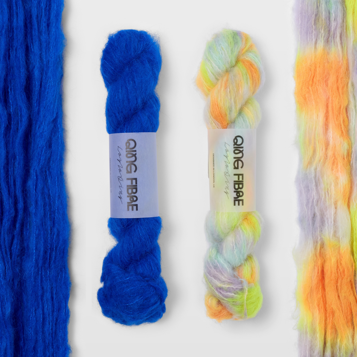 Hero and 600 Volts Melted Baby Suri 25g yarn, with two twisted skeins between the open skeins on a grey background.