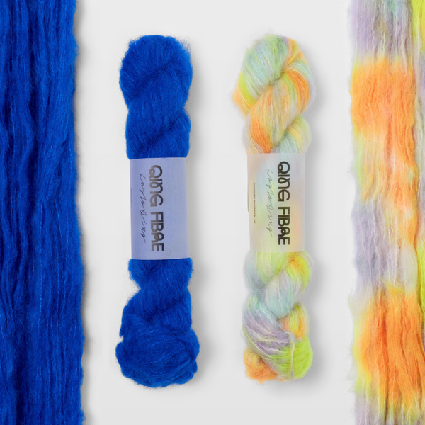 Hero and 600 Volts Melted Baby Suri 25g yarn, with two twisted skeins between the open skeins on a grey background.