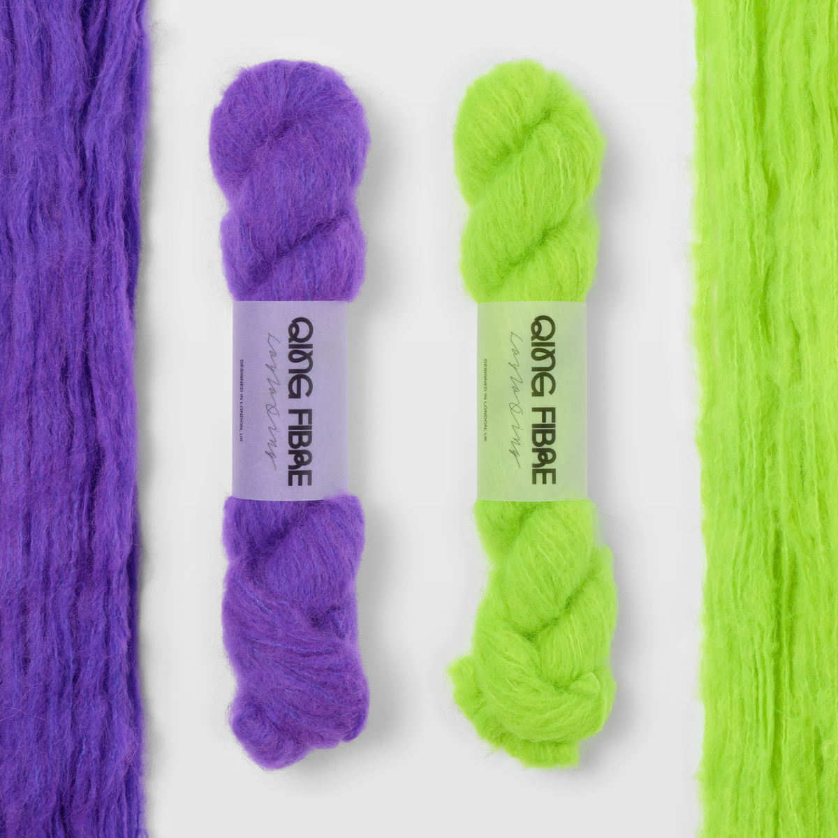 Prince and Ninja Turtle Melted Baby Suri 25g yarn, with two twisted skeins between the open skeins on a grey background.