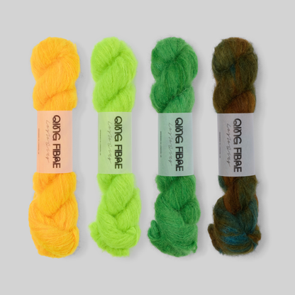 Golden Green Suri 25g fade set: Cheese, Ninja Turtle, Grass and Nyx twisted skeins arranged from golden orange through bright green to dark green.