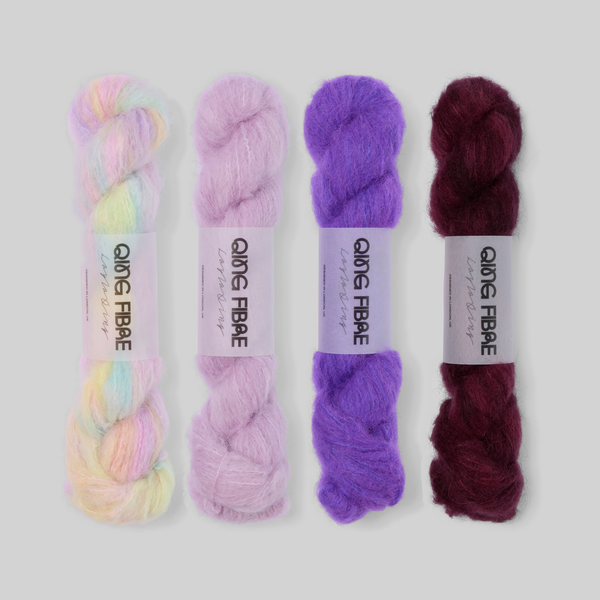 Lilac to Plum Suri 25g fade set: Mother of Pearl, Thistle, Prince and Hush twisted skeins arranged from pearly pastels through lilac and violet to deep plum.