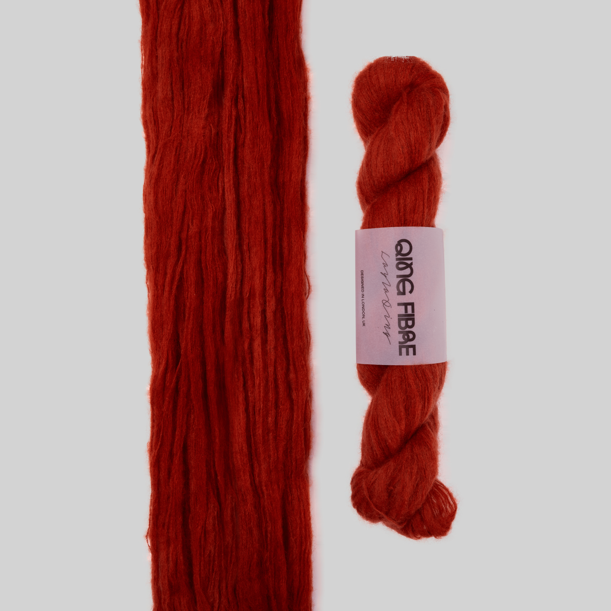 Veranita All Hallows yarn, with an open skein and twisted skein on a grey background
